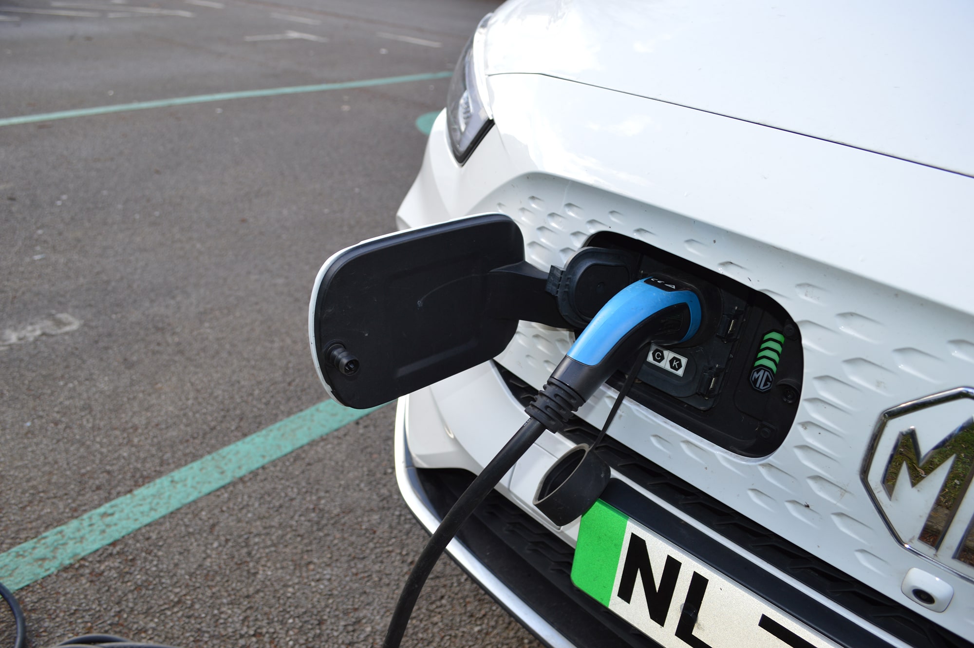 Close-up of an EV charge point socket ready for use